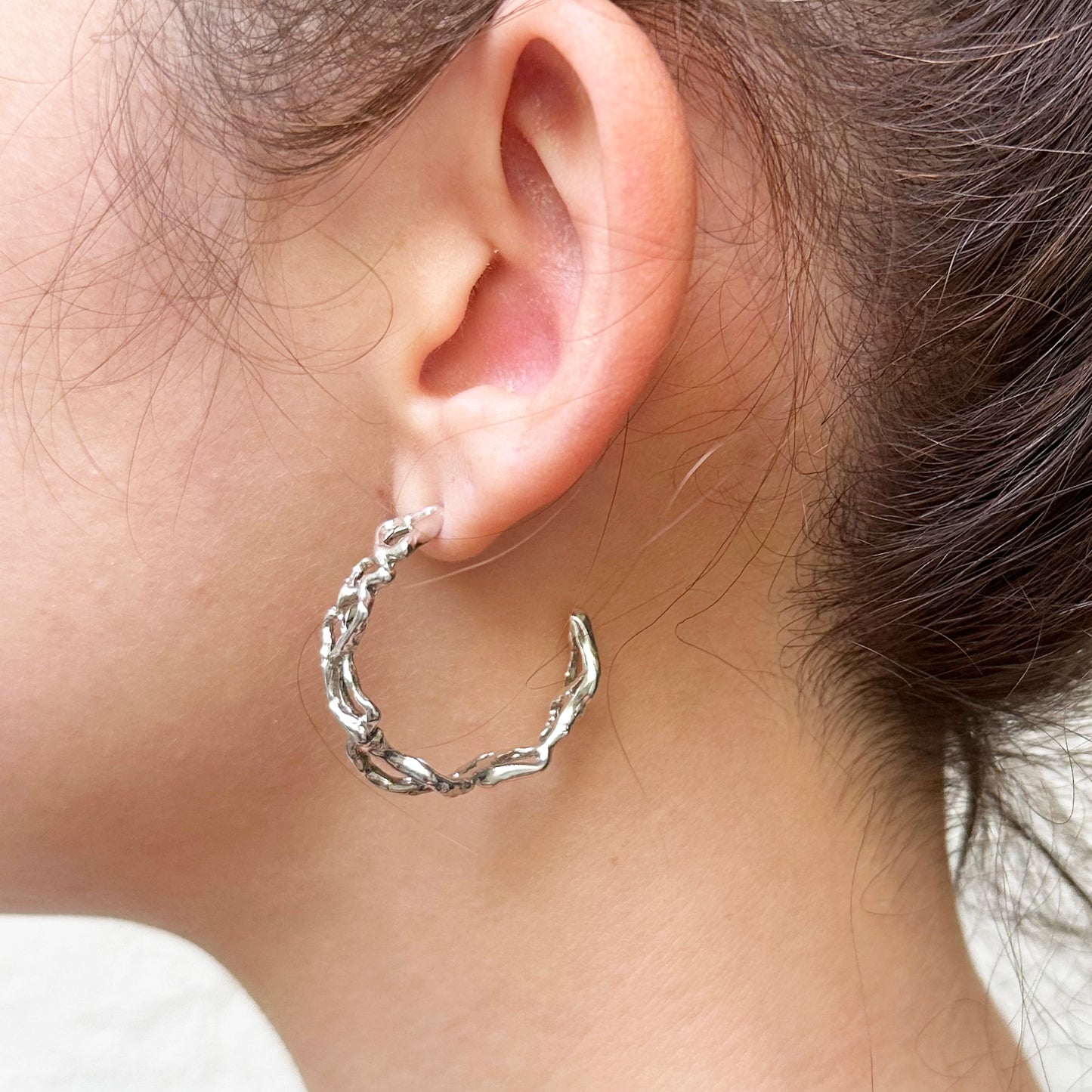 
                  
                    Roots Hoop Earrings
                  
                