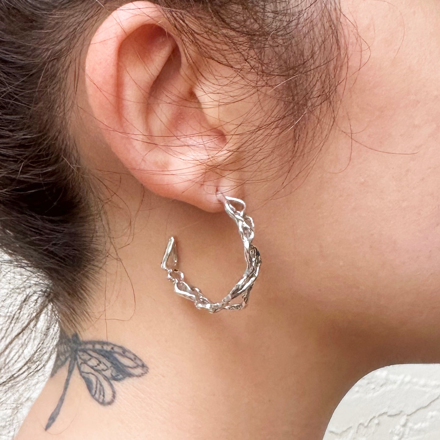 
                  
                    Roots Hoop Earrings
                  
                